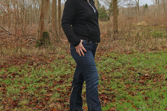 Anne standing in a woodland