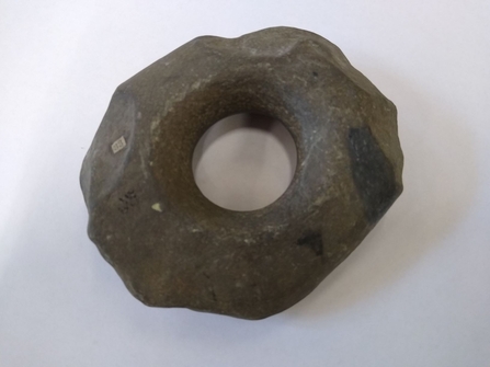 Perforated hammerstone