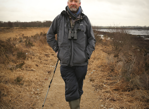 Dave stands on a nature reserve