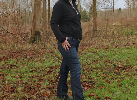 Anne standing in a woodland