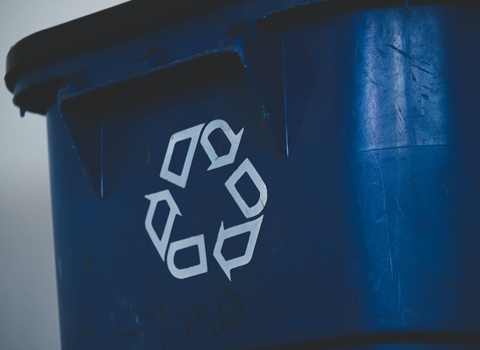 Plastic bin with recycle symbol