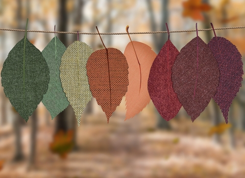 Leaves cut out of fabric in different autumnal colours