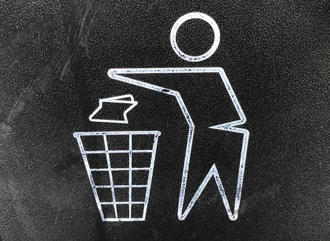 Outline symbol of person throwing waste in bin